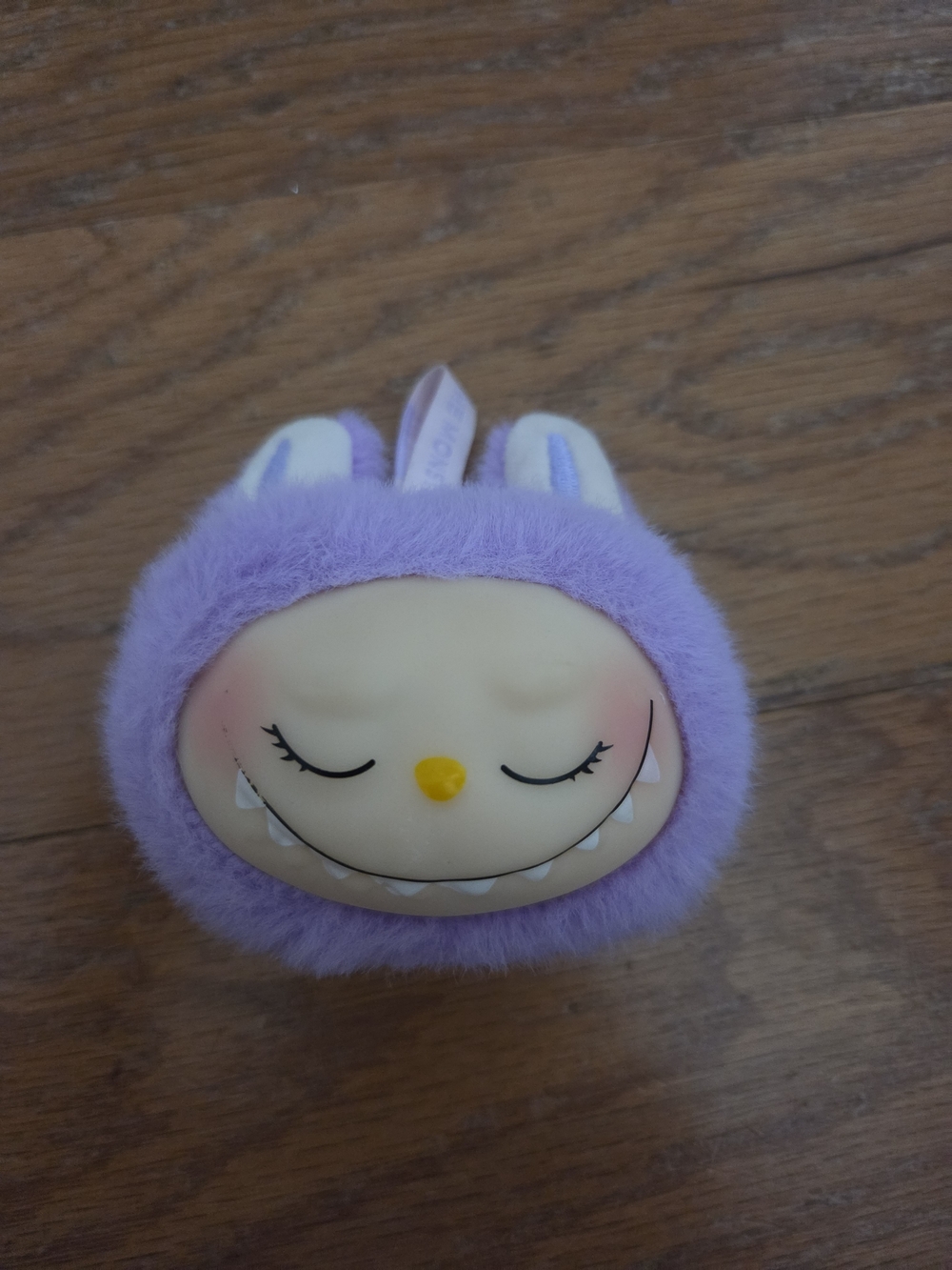 purple Labubu "Zizi" plush keychain from Pop Mart. The Monsters Series
